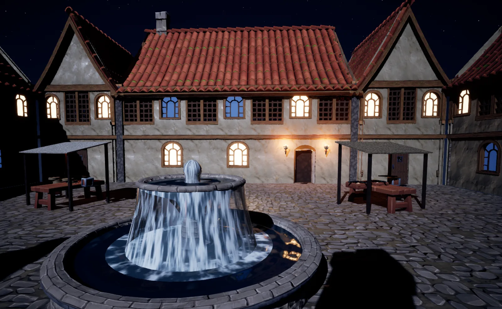 The market square in Unreal Engine at night: the fountain in front, the Salt Barrel behind with its windows lit